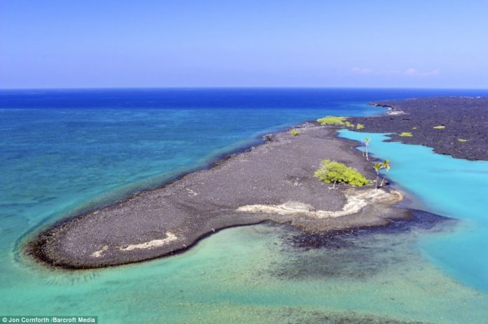 An image of the beautiful turquoise waters of Kiholo Bay located on the Kohala Coast on volcanic Big Island