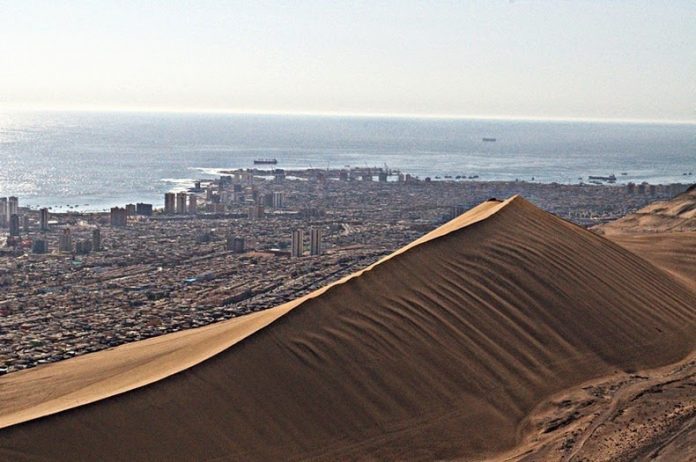 Cerro Dragon or The Dragon Hill is a massive sand dune that is approximately four kilometers long, situated nearby the coast in the city of Iquique in Chile.