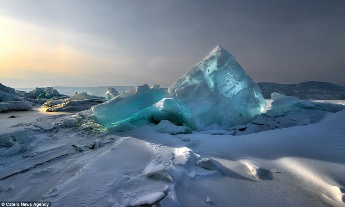 Andrey captured magical images of huge blocks of blue ice, known as ice hummocks, which glistened like precious stones