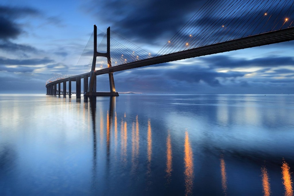 The Ponte Vasco da Gama bridge is a cable-stayed bridge flanked by viaducts and a range of views that spans the Tagus River in Parque das Nacoes in Lisbon, the capital of Portugal.