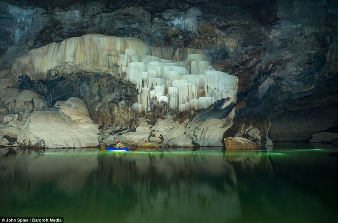 Visitors to Tham Khuon Xe can rent canoes or kayaks and paddle upstream to view the stunning calcifications on the cave walls