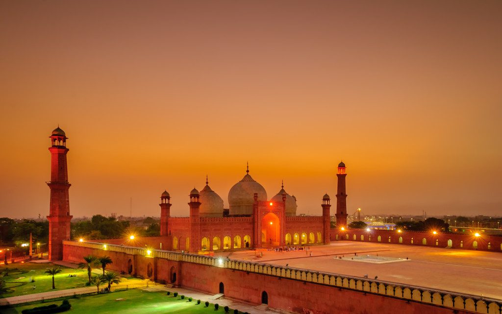 The Badshahi Mosque was built in 1673 by the Mughal Emperor Aurangzeb in Lahore, Pakistan. The large orange-coloured building is capable of accommodating over 55,000 worshippers