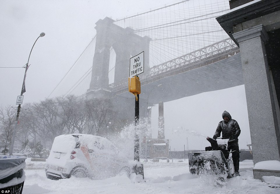 Ten inches of snow fell in Manhattan on Saturday morning with more expected to come as winter storm Jonas advanced up the East Coast