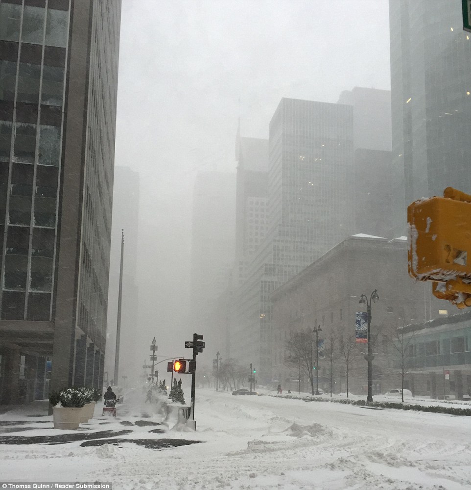 Winds of up to 50mph and heavy snow in Manhattan on Saturday caused near white-out conditions as storm Jonas arrived