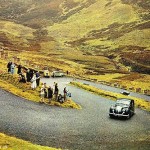 Crowds watch Queen Elizabeth II being driven along The Devil's Elbow to Balmoral by Prince Philip in 1967
