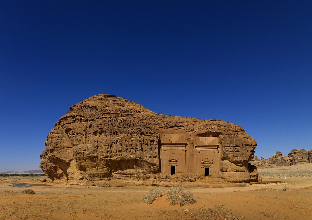 Madain Saleh in Saudi Arabia, a sister city to Jordan’s Petra. UNESCO world heritage site, located in the Al-Ula sector, within the Al Madinah Region of Saudi Arabia. The Archaeological Site of Al-Hijr (Madain Salih) was formerly known as Hegra, it is the largest conserved site of the civilization of the Nabataeans south of Petra in Jordan. It features well-preserved monumental tombs with decorated facades dating from the 1st century BC to the 1st century AD. With its 111 monumental tombs, 94 of which are decorated, and water wells, the site is an outstanding example of the Nabataeans' culture.