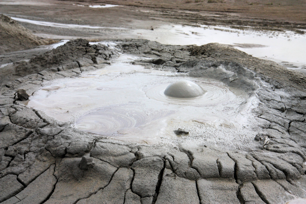 This is known as "mud volcanoes" and they’ve formed in places where pockets of underground gas have found a feeble spot in the earth where they can force their way to the surface. 