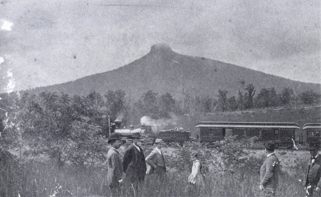 An excursion train within sight of Pilot Mountain in 1891