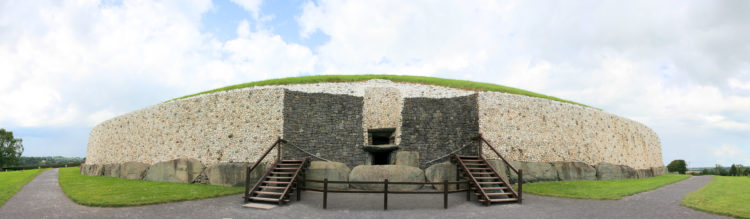 The Newgrange is a large circular mound with a stone passageway and interior chambers. 