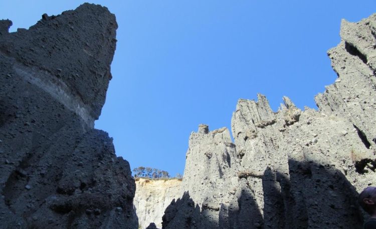 The Island was submerged when the sea level rose again, but after the Ice ages, the sea level go back and old alluvial fans have been unprotected to the erosive forces of wind and water have weathered away the conglomerate. 