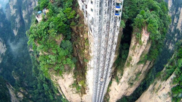 The lift is literally Hundred Dragons Elevator that is 1,070 feet high, claimed to be the highest and heaviest outdoor elevator in the world. 