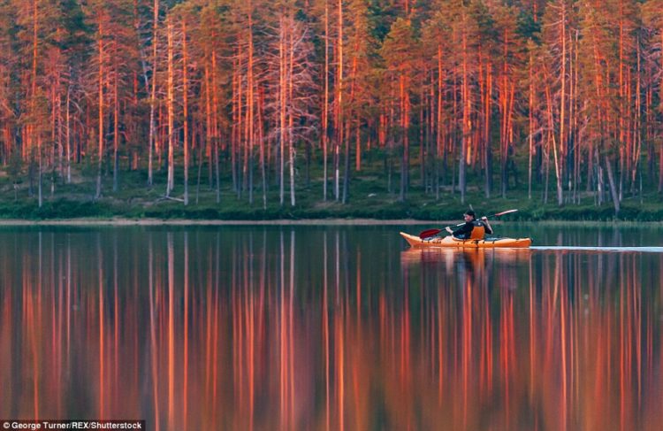 Kayaking under the midnight sun in Hossa, Finland. To get to this spot, Turner and his friend had to paddle for over an hour into the wilderness