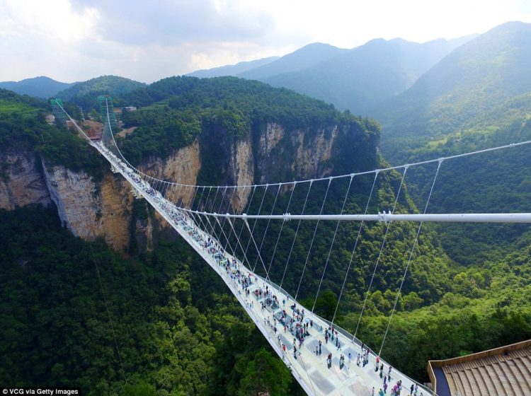 The new glass-bottomed bridge crosses two peaks in the mountains of Zhangjiajie - the same ranges that inspired the American blockbuster Avatar