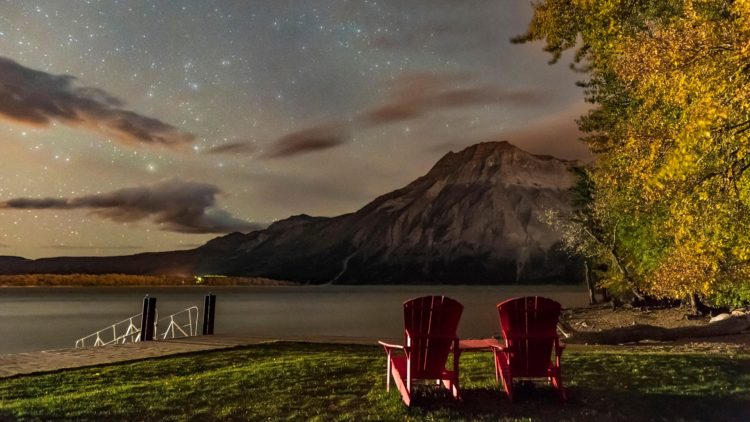 A nightscape scene at Linnet Lake area in Waterton Lakes National Park, looking east over Upper Waterton Lake and toward Vimy Pe