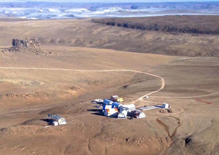 The Haughton crater on Canada's Devon Island, which is so other-worldly, scientists (pictured) have set up camp there to conduct Mars-related research