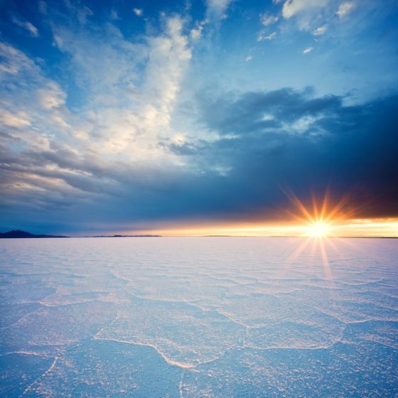 The sun rises over Bolivia's 4633-square-mile Salar de Uyuni, the largest salt flat in the world - remnants of a prehistoric lake that dried up long ago