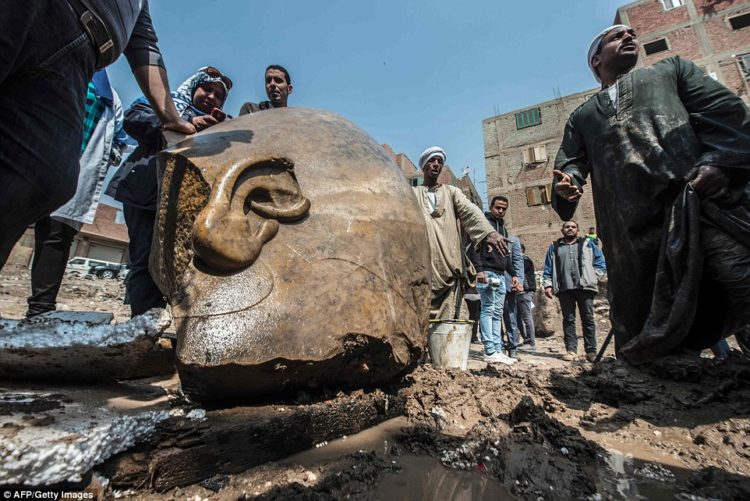It is believed to be a mammoth statue of Ramses the Great. It was pulled from the mud and groundwater by a bulldozer