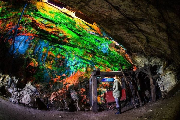 The fluorescent exhibits are displayed along the walls of Rainbow tunnel that was excavated in 1990, are lined with rare minerals that glow bright green and red under ultraviolet light. 