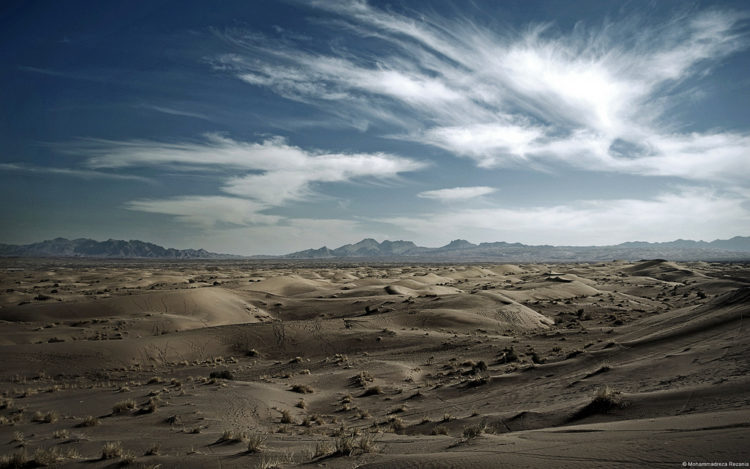 The Dasht-e Kavir, is one of two deserts dominating the region's landscape, is a mix of sand and salt as blinding in its whiteness as it is deafening in its silence. 