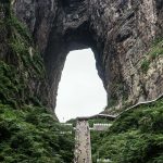 China Heaven Gate in Hunan province is named after an unbelievable cave natural arch eroded through the karst syncline.