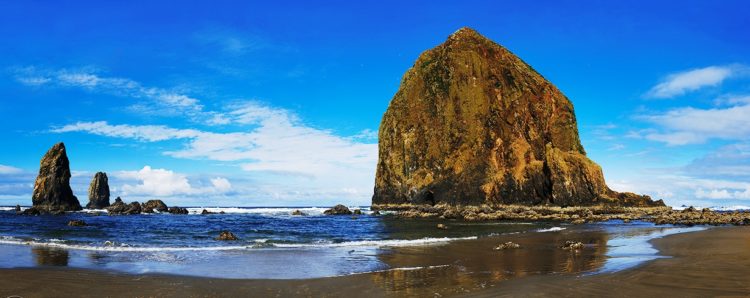 They're are 6 other geographic features in Oregon named Haystack Rock, including two others along the Oregon Coast and others throughout the U.S. Haystack Rock is accompanied by several smaller rocks known as The Needles.