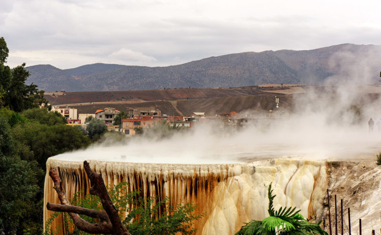 Most impressive group of powerful springs mound flow Travertine for most part is bright white but there are several places where the iron compounds and microorganisms have colored the travertine in various shades of red, orange and brown. 