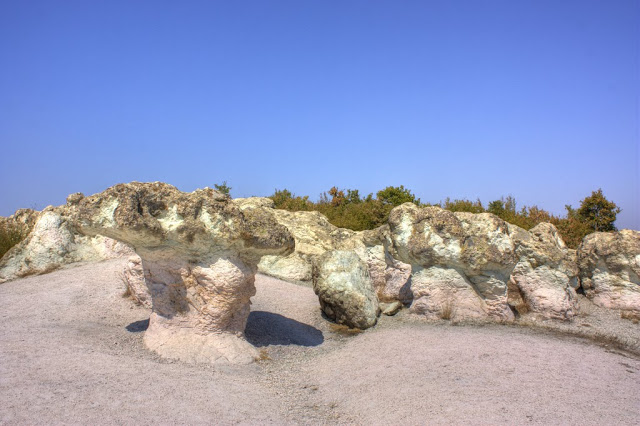 They are formed just the way table rocks are formed eroded into shape over years and years, as the water that once nearly submerged them lapped against there walls. 