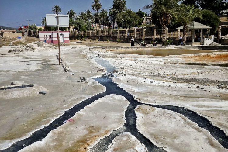  The amazing Hammam Meskhoutine hot springs have formed numerous amazing travertine formations including approximately 30 m tall mound with beautiful rimstone pools and petrified waterfalls. Hot spring channels with some view of the town