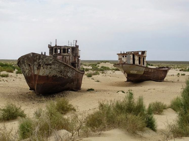 Except this isn’t a mirage you’ve reached the Graveyard Ships of Mo’ynaq, a surreal collection of rusting fishing vessels in Uzbekistan, stranded nearly 100 miles from the nearest shoreline. Mo‘ynaq, Graveyard of Ships in the Desert. Image credit Globespotter