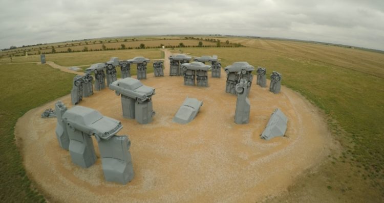 As you know, that original Stonehenge is built with large standing stones, but Carhenge is built from vintage American automobile, but all covered with gray spray paint.