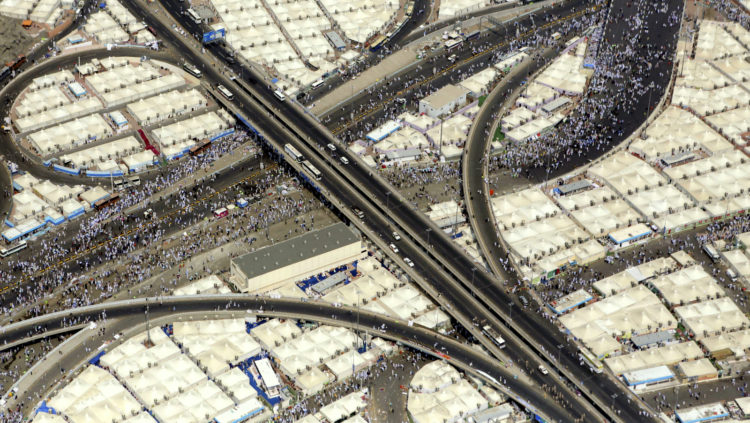 Oct. 5, 2014 photo, shows an aerial view of thousands of Muslim pilgrims as they make they're way to throw stones at a pillar, symbolizing the stoning of Satan during the annual pilgrimage, known as the hajj, in Mina outside of Mecca, Saudi Arabia. The roughly five-day hajj is meant to cleanse the faithful of sin and required of all able-bodied Muslims to perform once in they're lives. Though pilgrims will repeat the stoning ritual for two days, they can now be referred to as "hajjis," a term of honor for completing the pilgrimage. (AP Photo/Khalid Mohammed)