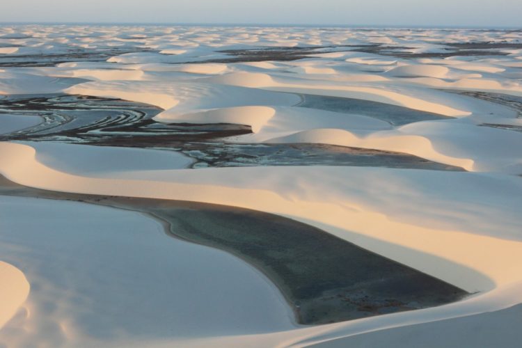 Lencois Maranhenses Sand Dunes of Brazil look like average sand dunes, and valleys are filled with water since the low-lying lands often flood during the wet season.