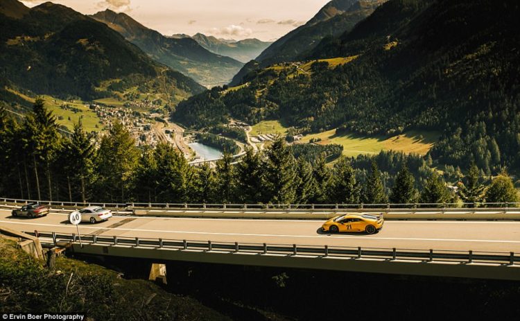 The group of cars on the rally trip head down the Gotthard Pass in Switzerland.