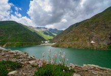 Lulusar Lake – Unspoiled Gem in High Mountains Peaks Lulusar Lake is wreathed in blue and gold wild flowers enchanting beauty and its view remains in the mind of tourist for a long time.