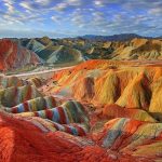 The naturally formed landscape is alive with shades of green, orange, blue, emerald, red and yellow. Source: Huffington Post-2