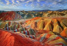 Discover Magical Rainbow Mountains China The naturally formed landscape is alive with shades of green, orange, blue, emerald, red and yellow. Source: Huffington Post-2