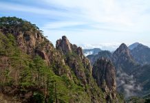Mount Danxia – World Famous UNESCO Geopark of China Mount Danxia “Dānxiá Shān” is a prominent scenic mountainous area near Shaoguan city in the northern part of Guangdong China.