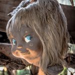 Terrified by the spirit, he started collecting dolls. He would find in the canal, from heaps of trash and hundreds of toys. Then some missing body parts from the trees and the wire fencing which surrounded his wooden shack.