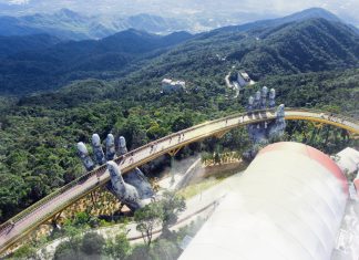 Giant Hands Lift up The Golden Bridge Vietnam The Golden Bridge hands are decorated with cracks and moss to make them look like aged stone ruins. Photo Credit www.dezeen.com