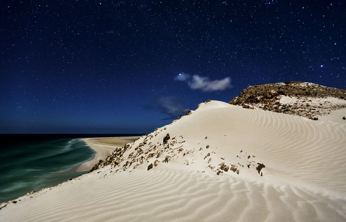 Qualensia Beach and starscape at dusk