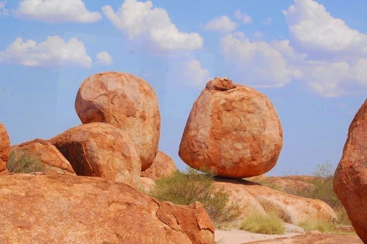 These boulders in fact formed on the ground they stand by erosion of rock that reached the surface from below. 