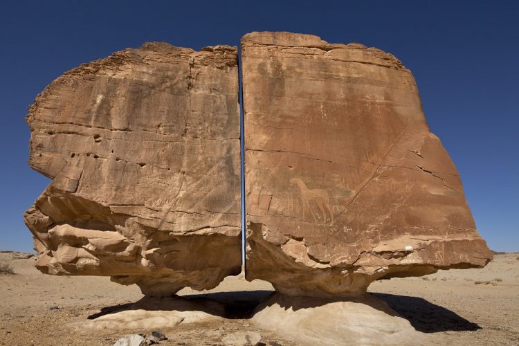 Al Naslaa Rock is located in Tayma oasis, Saudi Arabia. The archaeologist believes Tayma has been inhabited from ancient times. 