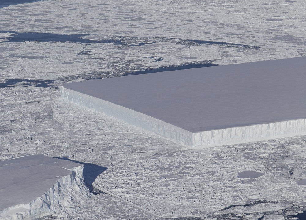 We often see icebergs with geometric shapes, although such a perfect rectangle is admittedly unusual.