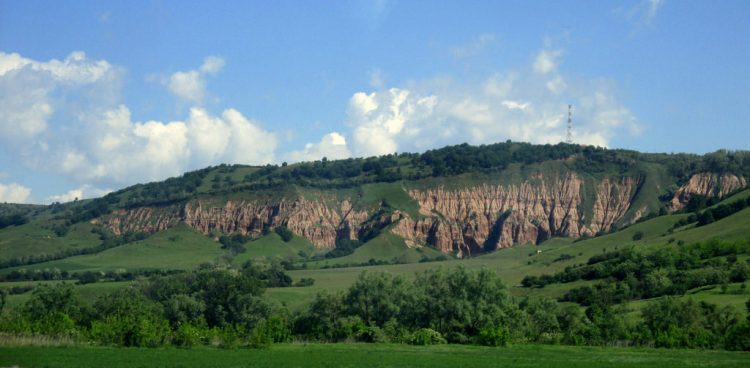 Râpa Roșie is a protected area, in Alba County, Romania. It is a geological and botanical reserve with a size of approximately 24 hectares; the reserve is classified as IUCN Category III. 