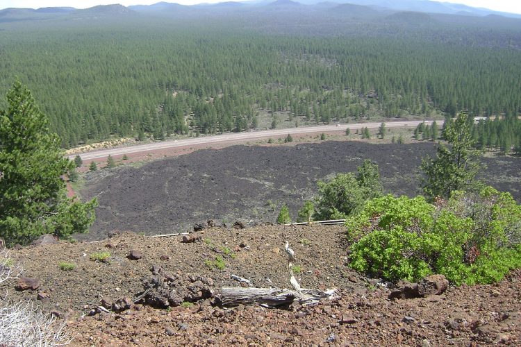 It is part of a system of small cinder cones is capped by a crater, normally extends about 60 feet deep beneath its south rim and 160 feet deep from north side. 