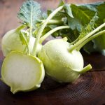Kohlrabi is a hardy biennial grown as an annual and is a member of the cabbage clan. It has a swollen stem that takes it look like a turnip growing on a cabbage root.