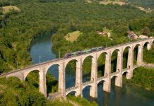 Cize–Bolozon Viaduct – A Rail-Road Crossing Bridge SNCF B 81661 is a spectacular passing scene on the Cize–Bolozon Viaduct which is a road-rail bridge crossing the Ain gorge in France.