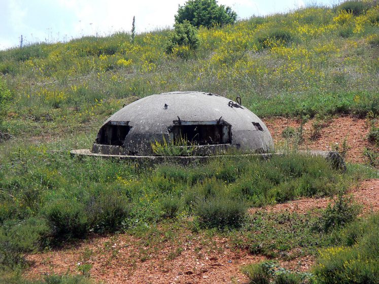 Bunkers in Albania domed concrete roofs and narrow eye slits crouched suggestively on either side of the road to Tirana.