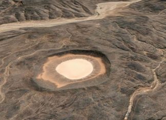 Amguid Crater: A Remote Wonder in Algeria A meteorite crater named Amguid Crater. This is roughly 65 meters deep and around 500 to 530 meters in diameter (measured with Google Earth).