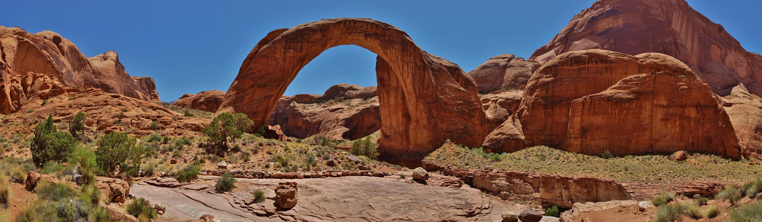 The span of Rainbow Bridge is approximately 290 ft tall, spans 275 ft and the top is 42 feet thick and 33 feet wide.